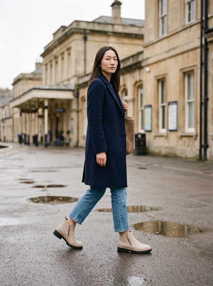 Women's Ankle Boots – Beige – worn on a rainy station forecourt