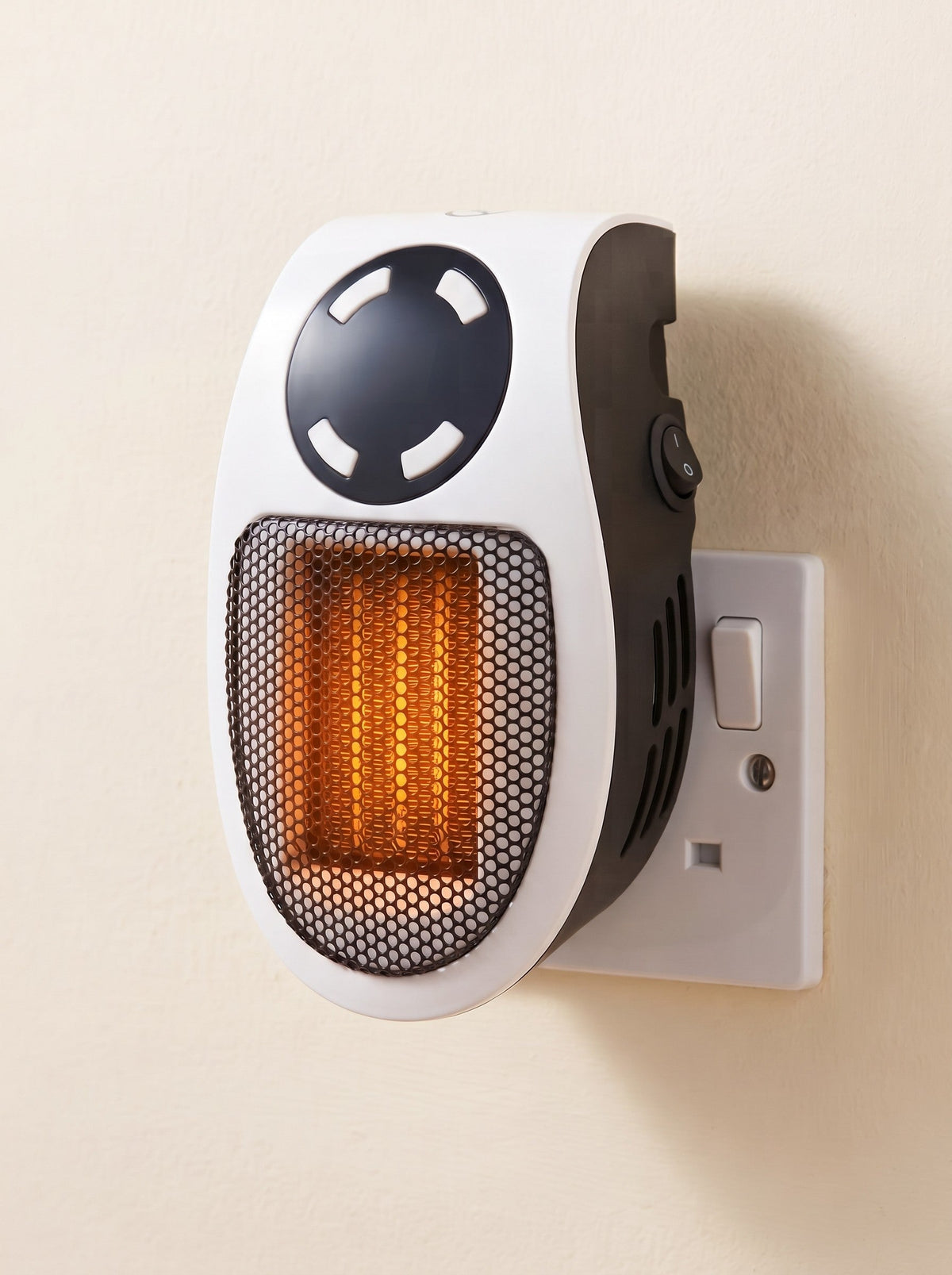 Plug In Heater 500 W – White – plugged into a UK wall socket, switched on