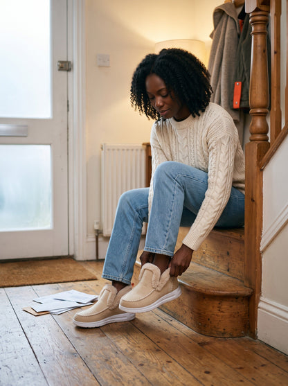 Women's Fleece-Lined Slip-On Boots – Beige – worn in a hallway